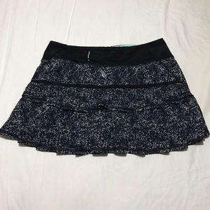 Lululemon size 4 tennis skirt. Black with pattern.